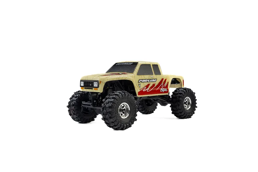 A 1/30 scale Pro-Line Coyote RC crawler with a tan topographical painted body shell, featuring red graphics and chrome wheels on a white background.