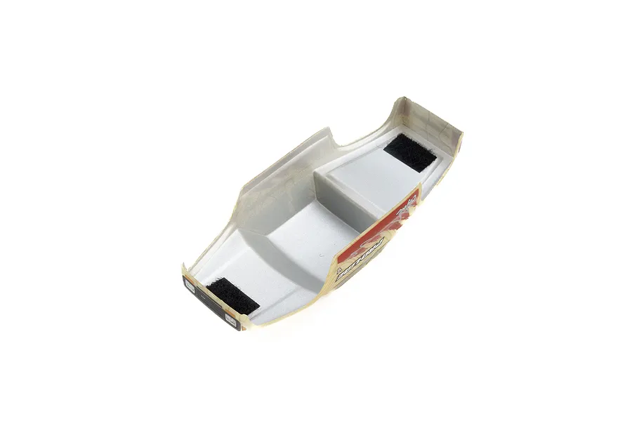 Underside view of a Pro-Line Coyote RC body shell showing the silver interior, velcro mounting strips, and printed exterior graphics.