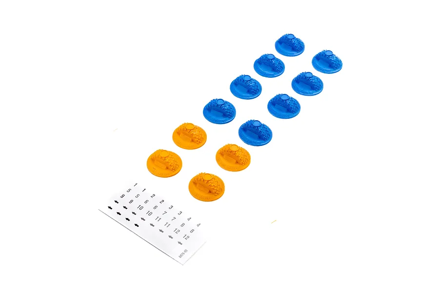 A set of 12 Pro-Line gate markers in blue and orange, shaped like miniature tires, with a sticker sheet containing numbers 1-12 and arrows.