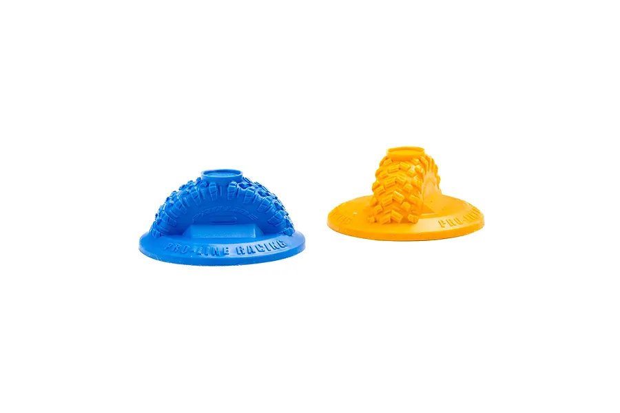 One blue and one orange Pro-Line gate marker, each featuring a molded tire tread design on a circular base, isolated on a white background.