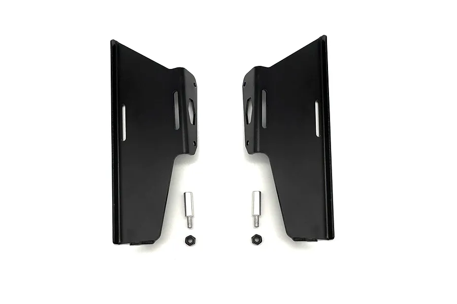 A pair of black aluminium RC slider and cab mount plates with two silver metal posts and two black nuts on a white background.