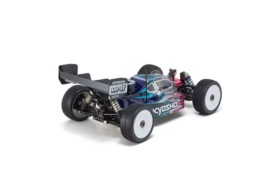 Rear three-quarter view of the Kyosho Inferno MP11 1/8 scale nitro RC buggy, featuring a blue, black, and pink painted body and white wheels.