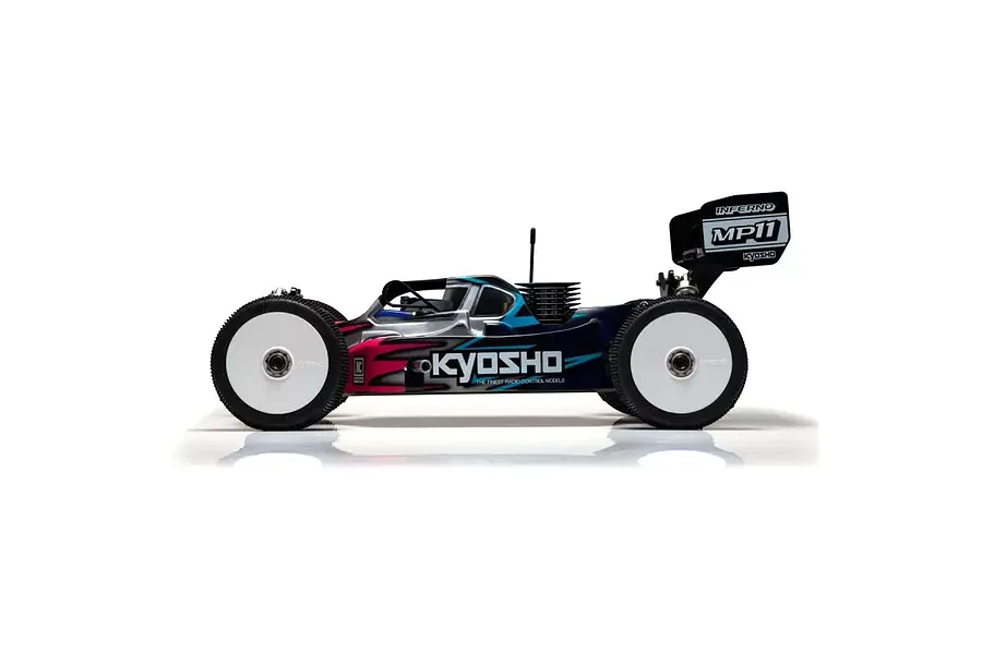 Side profile of a Kyosho Inferno MP11 1/8 scale nitro RC buggy with a custom painted body, white wheels, and rear wing.