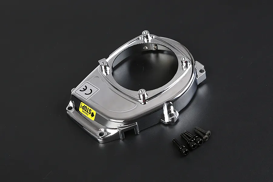 A chrome-plated Rovan engine cover for an RC car, featuring a yellow 'ENGINE STOP!' sticker and four included black mounting screws on a dark background.