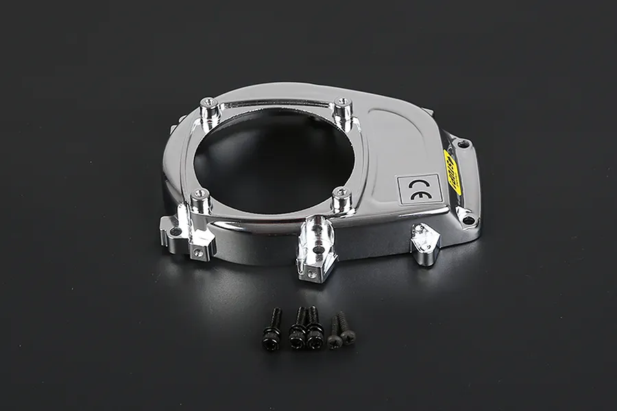 A chrome-finished Rovan engine cover for an RC car, shown with five small black mounting screws on a dark grey background.