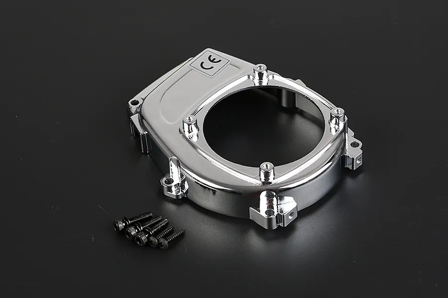 A chrome-plated Rovan engine cover for an RC car, shown with five small black mounting screws on a dark background.