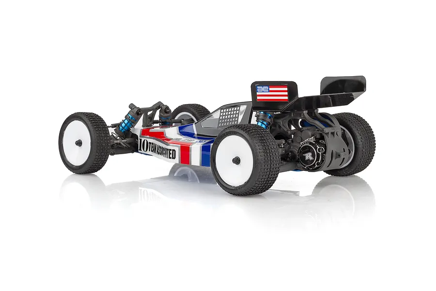 Team Associated RB10 1/10 scale 2WD electric RC buggy, rear three-quarter view, featuring a red, white, and blue livery and white wheels.