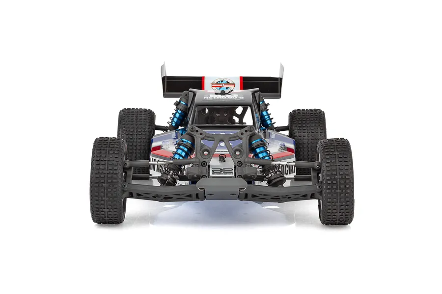 Front view of the Team Associated RB10 Retro Kit 2WD RC buggy, featuring a black, white, red, and blue body with blue anodized shock absorbers.