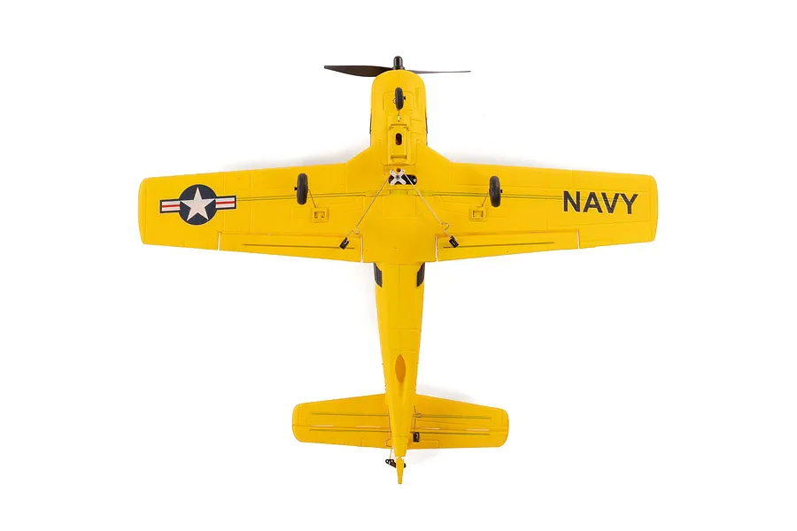 Bottom view of a yellow HobbyZone T-28 Trojan RC plane showing the landing gear, propeller, and US Navy markings on the wings.