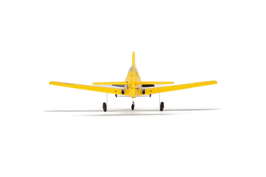 Rear view of a yellow HobbyZone T-28 Trojan RC plane on a white background, showing the tail, wings, and landing gear.