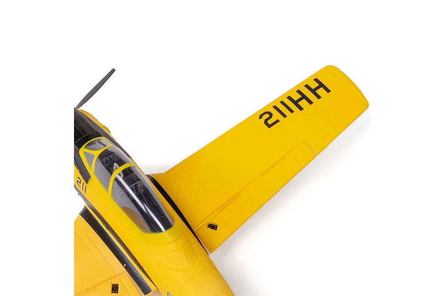 Top-down view of a yellow HobbyZone T-28 Trojan RC plane showing the cockpit and wing detail.