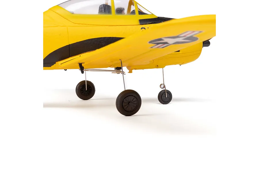 Close-up of the landing gear and underside of a yellow HobbyZone T-28 Trojan RC plane against a white background.