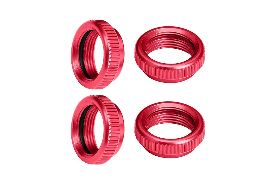 Four red anodized aluminium shock collars for RC cars, featuring a knurled outer edge and internal threading.