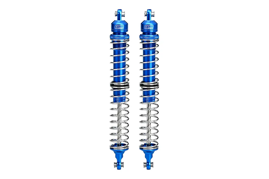 Two GPM Racing blue aluminium adjustable double-spring RC shock absorbers standing vertically against a white background.