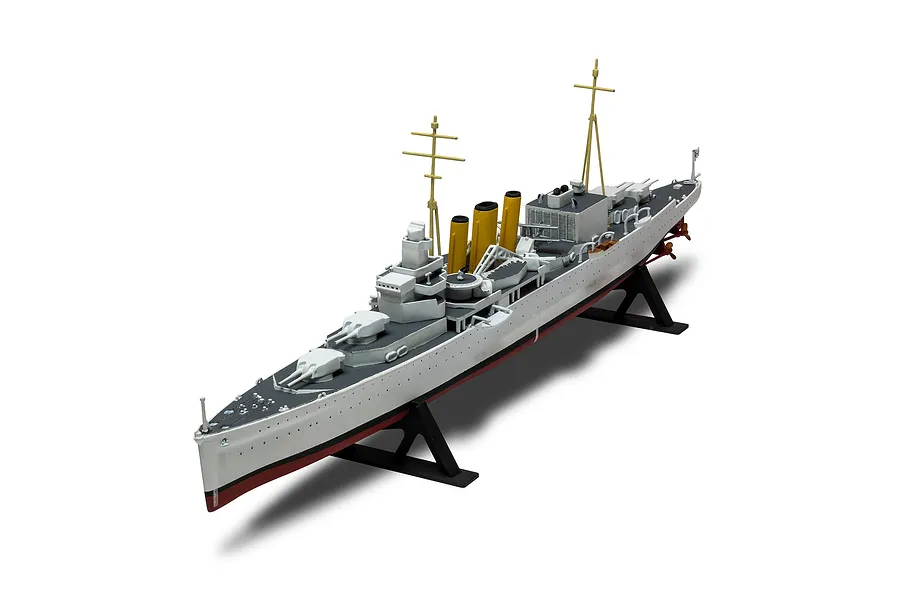 A high-angle studio shot of a fully assembled and painted 1/600 scale model of the HMS Suffolk heavy cruiser, mounted on a black display stand.