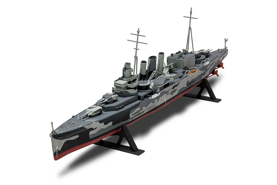 A fully assembled and painted 1/600 scale model of the HMS Suffolk heavy cruiser, displayed on a black plastic stand against a white background.