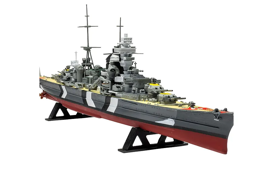 A completed and painted 1/600 scale plastic model kit of the German heavy cruiser Prinz Eugen, displayed on a black plastic stand against a white background.