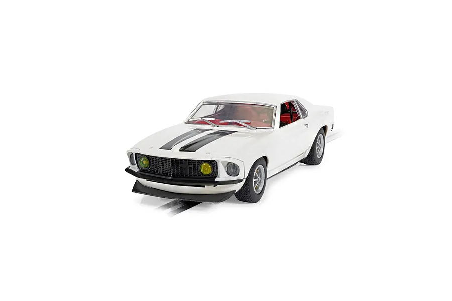 A 1/32 scale Scalextric Ford Mustang slot car in white with black racing stripes, featuring yellow fog lights and a detailed red interior.