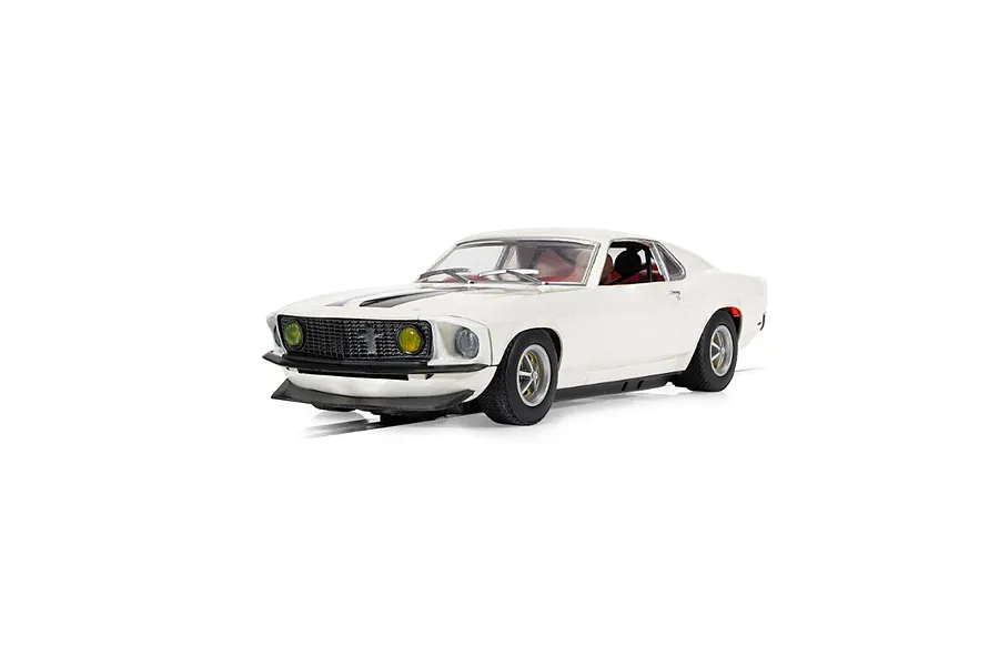 A 1/32 scale Scalextric Ford Mustang slot car in white with black racing stripes, featuring yellow headlights and a detailed interior.