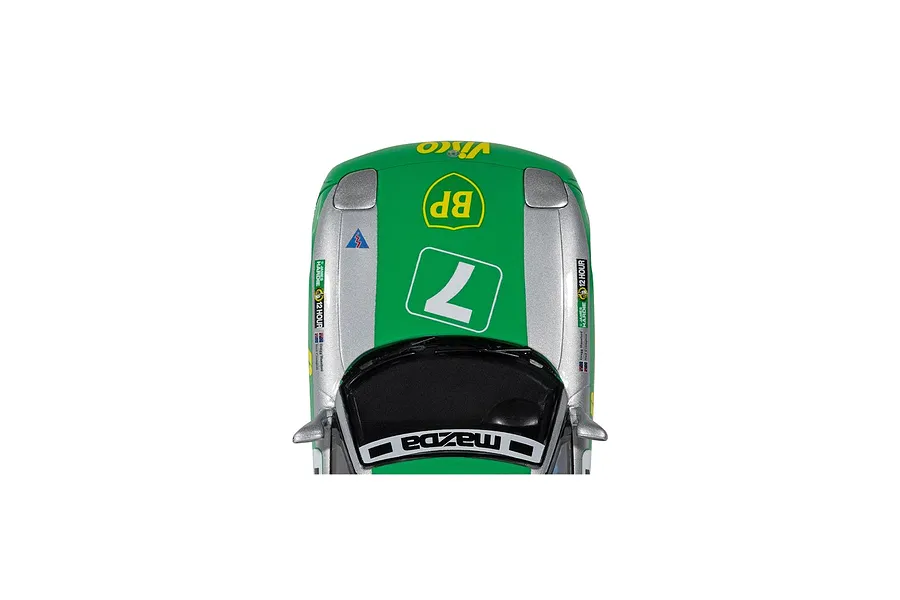 Top-down view of a Scalextric 1/32 scale Mazda RX-7 FD slot car in green and silver livery with number 7 racing decals.