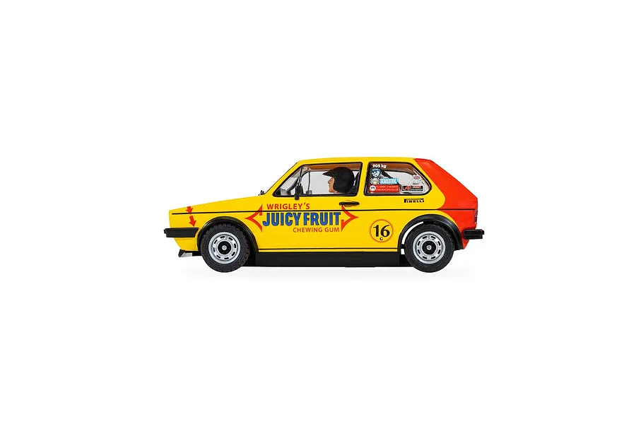 Side view of a yellow and red Scalextric 1/32 scale Volkswagen Golf MK 1 slot car with Juicy Fruit livery and racing number 16.