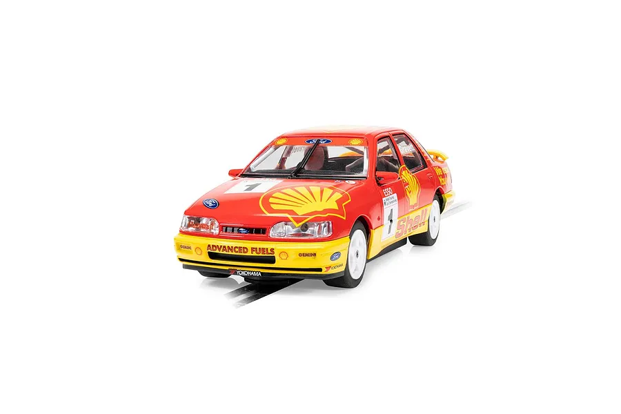 A 1/32 scale Scalextric Ford Sapphire RS500 slot car in red and yellow Shell racing livery, featuring number 1 and Rod Gravett branding.