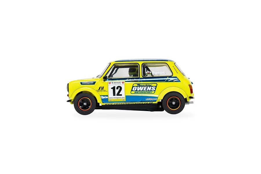 Side view of a yellow and blue Scalextric 1/32 scale Mini Miglia slot car, number 12, featuring Owens Motorsport branding.