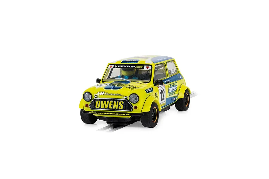 A 1/32 scale Scalextric Mini Miglia slot car in yellow and blue livery with number 12, driven by Endaf Owens, positioned on a slot car track.