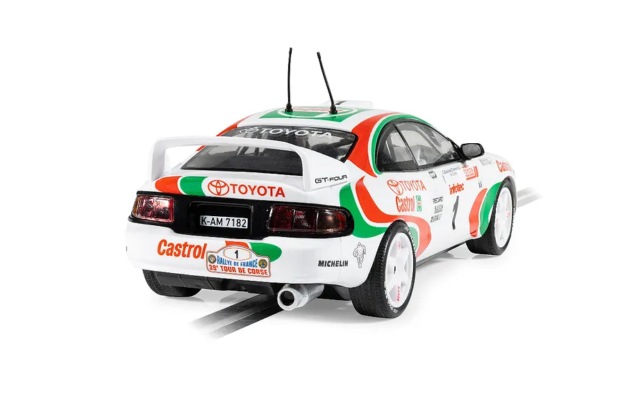 Rear three-quarter view of a Scalextric 1/32 scale Toyota Celica GT-Four rally slot car in white, green, and red Castrol livery.