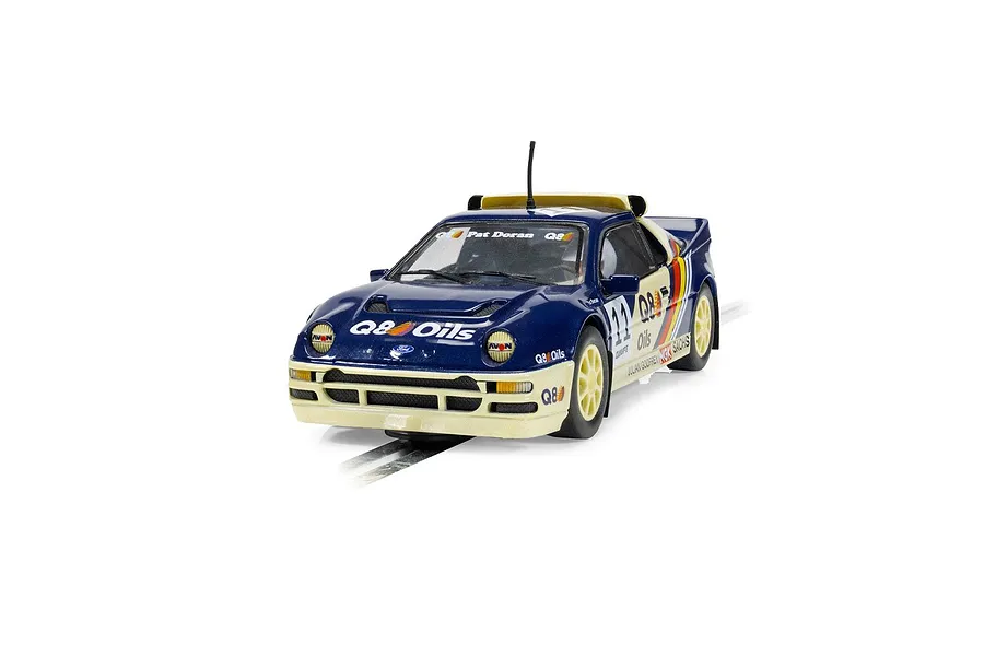 A Scalextric 1/32 scale Ford RS200 slot car in blue and cream livery with Q8 Oils branding, positioned on a slot car track.