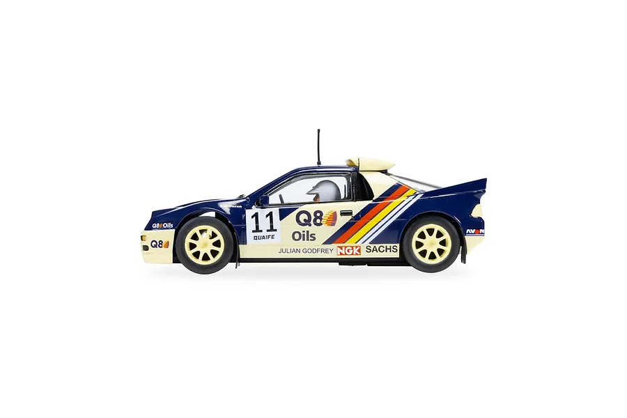 Side profile of a Scalextric 1/32 scale Ford RS200 slot car in blue and cream livery with number 11 and Q8 Oils branding.