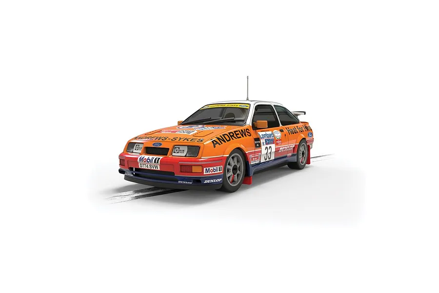 Scalextric 1/32 scale 1989 Ford Sierra RS Cosworth slot car in orange and white Heat for Hire livery with number 33.