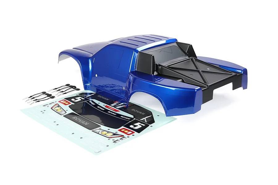A blue Rovan 1/5 scale 5SC short course RC truck body shell with a decal sheet and body clips on a white background.