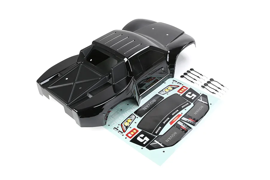A black Rovan 1/5 scale 5SC short course RC truck body shell with a decal sheet and body clips on a white background.