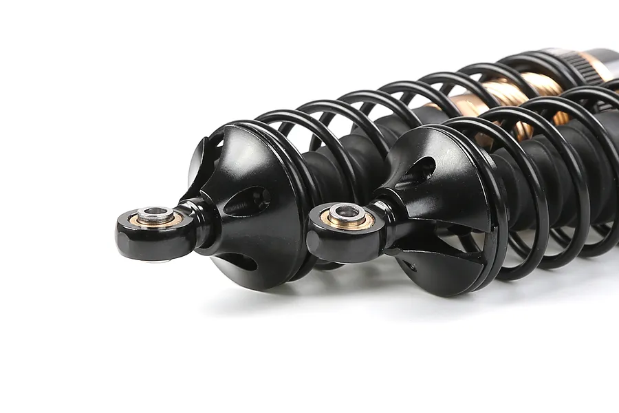 Two Rovan aluminium front adjustable shock absorbers in bronze and black finish, shown at an angle against a white background.