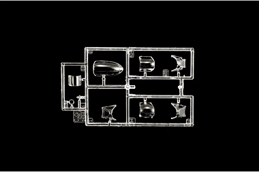 A clear plastic sprue containing various canopy and cockpit parts for a 1/48 scale model aircraft kit.