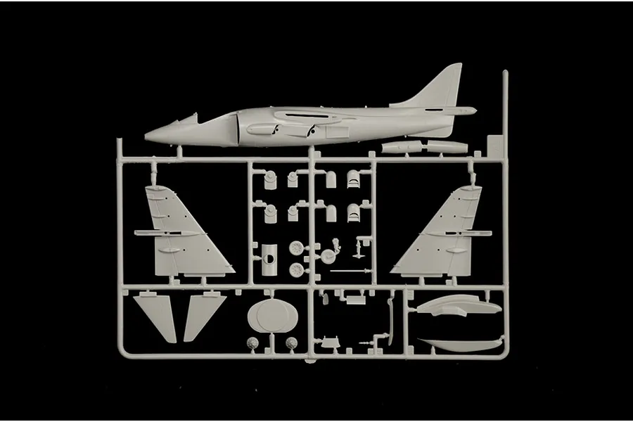 A grey plastic sprue containing parts for a 1/72 scale AV-8B Harrier II model aircraft kit, including the fuselage and wings.