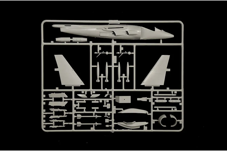 A grey plastic sprue containing various parts for an Italeri 1/72 scale AV-8B Harrier II model kit, including fuselage and wing components.