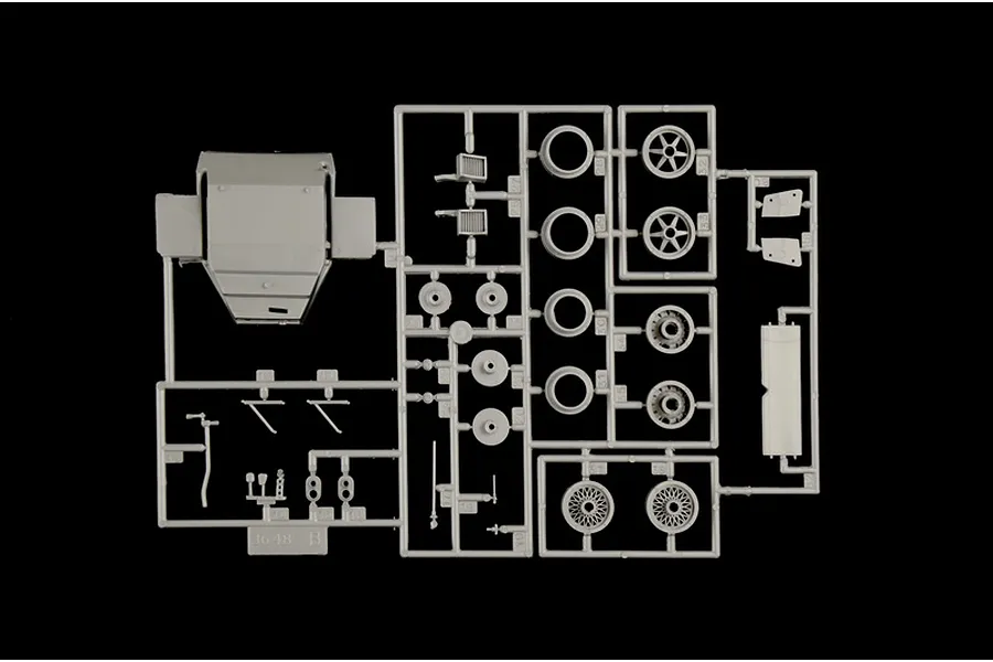 A grey plastic model kit sprue containing various car parts for an Italeri 1/24 Porsche 956 model.