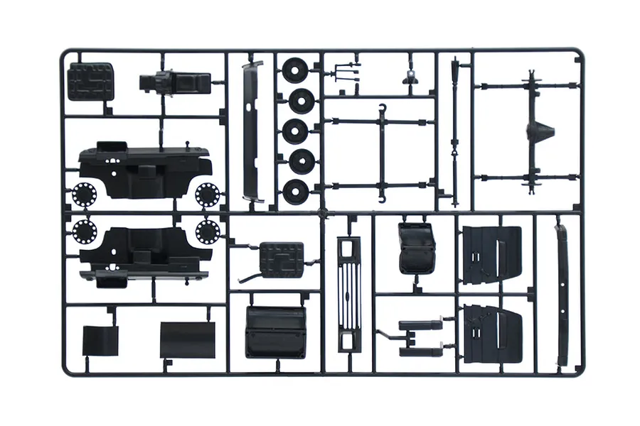 A black plastic sprue frame containing various unpainted model car parts for an Italeri 1/24 scale Ford Transit model kit.