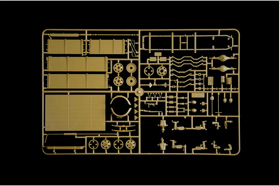 A tan plastic sprue containing various parts for an Italeri 1/35 scale Opel Blitz truck model kit, including truck bed panels, wheels, and chassis components.