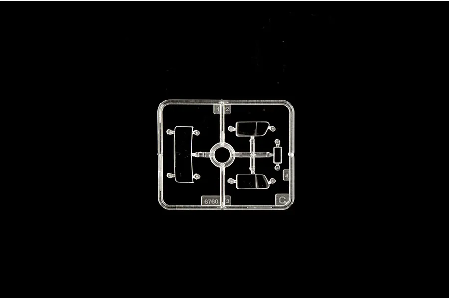A clear plastic sprue containing small window parts for an Italeri 1/35 scale model kit, set against a black background.
