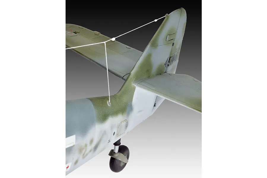 Close-up of the tail section of a 1/32 scale Messerschmitt Bf109G-10 model aircraft showing the camouflage paint scheme and antenna wire.