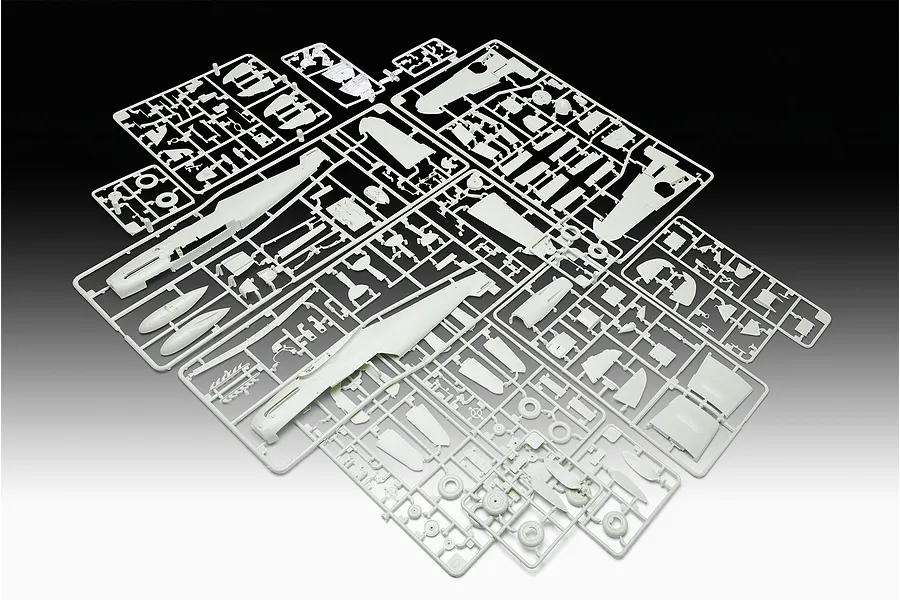 Several light grey plastic model kit sprues containing various aircraft parts for a Messerschmitt Bf109G-10 model, laid out on a gradient background.