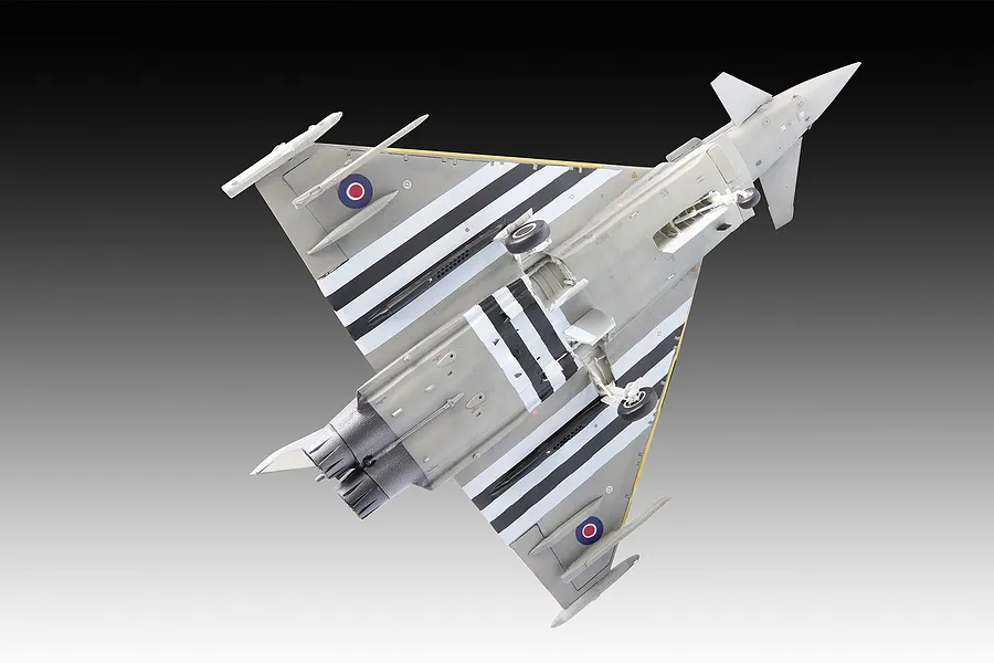 Underside view of a completed 1/48 scale Revell Eurofighter Typhoon plastic model kit featuring D-Day invasion stripes on the wings.
