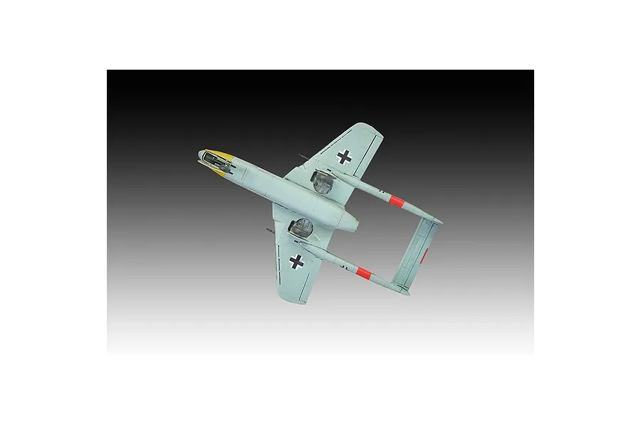 A top-down view of a completed 1/72 scale Focke-Wulf Flitzer model aircraft, painted in light grey with yellow nose and red tail markings.