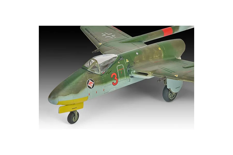 A detailed scale model of a Focke-Wulf Flitzer jet aircraft, painted in green and light blue camouflage with a red number 3 on the fuselage.