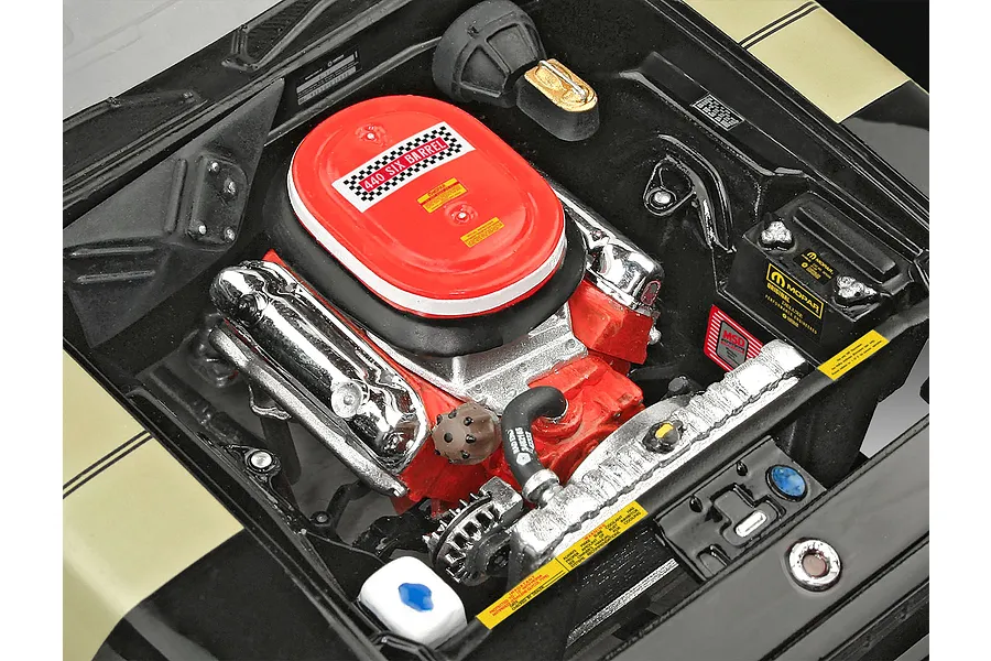 A detailed top-down view of the engine bay of a 1/24 scale model 1971 Plymouth GTX, featuring a red 440 Six Barrel air cleaner and chrome valve covers.