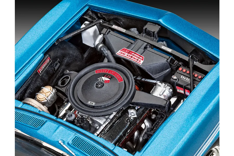 A detailed close-up of the engine bay of a 1/24 scale Revell 1969 Chevy Camaro Yenko model kit, featuring a black air cleaner and blue bodywork.