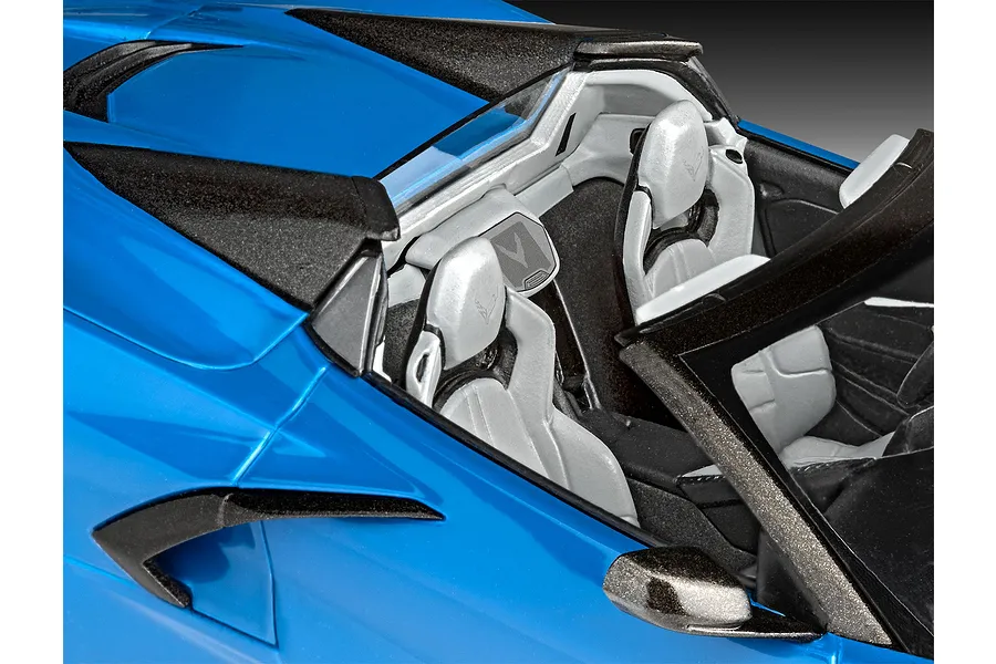 Close-up of the interior and blue exterior of a Revell 1/25 Corvette C8 Cabriolet plastic model car kit.